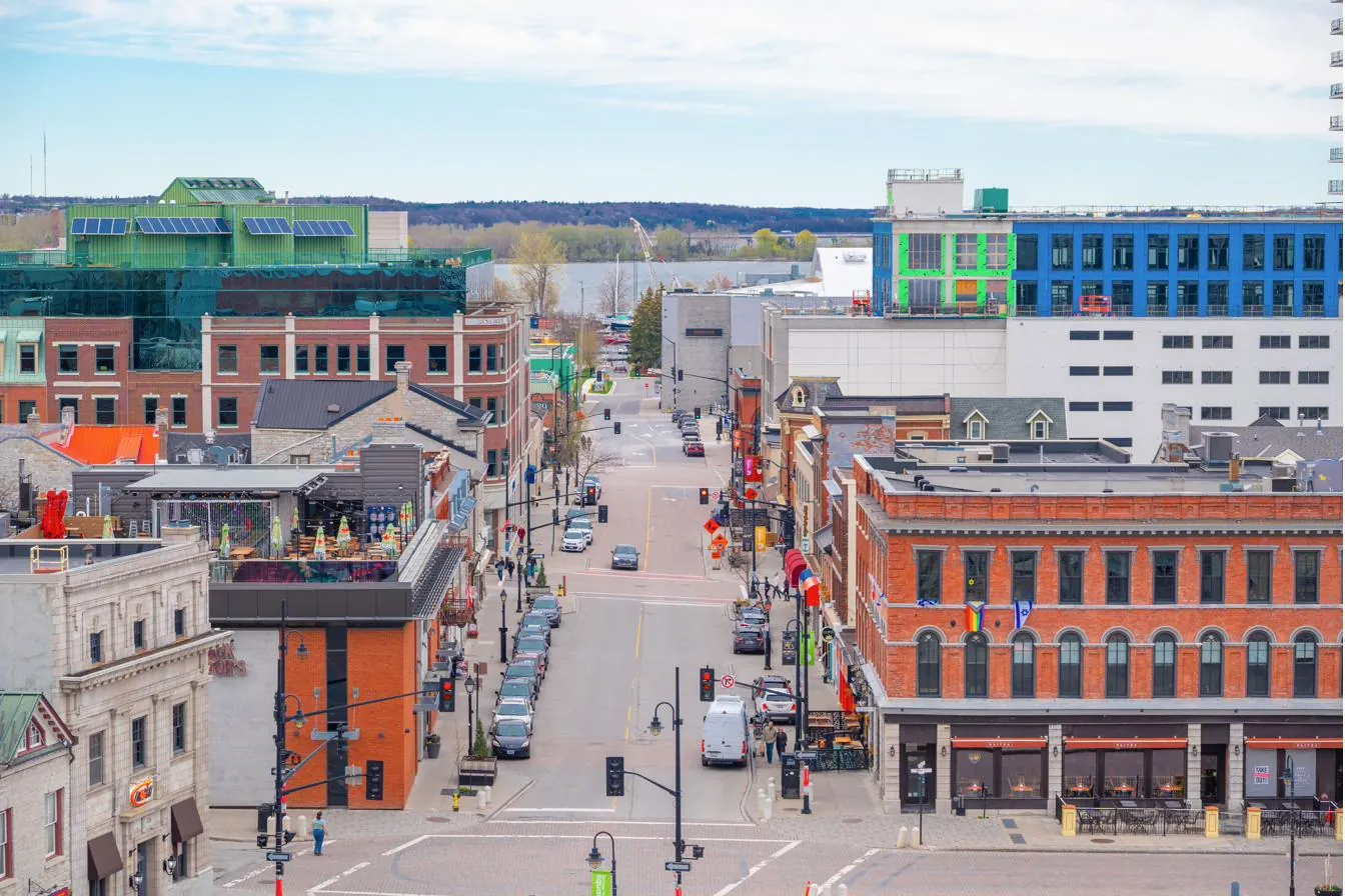 A downtown Burlington street of brick storefronts sloping toward Lake Ontario