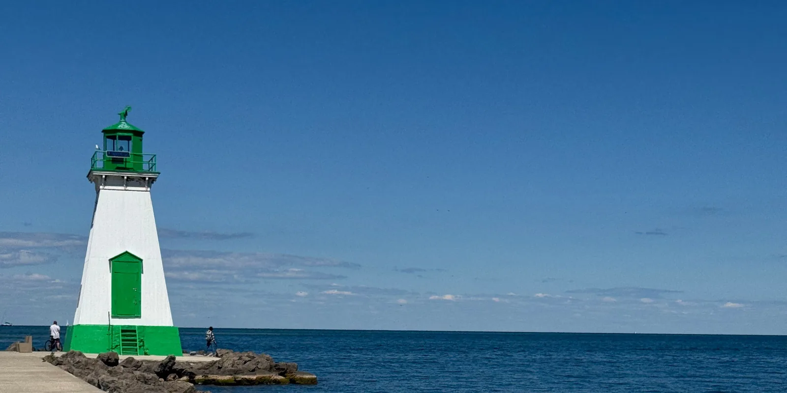 The green-and-white lighthouse and pier at Port Dalhousie on Lake Ontario